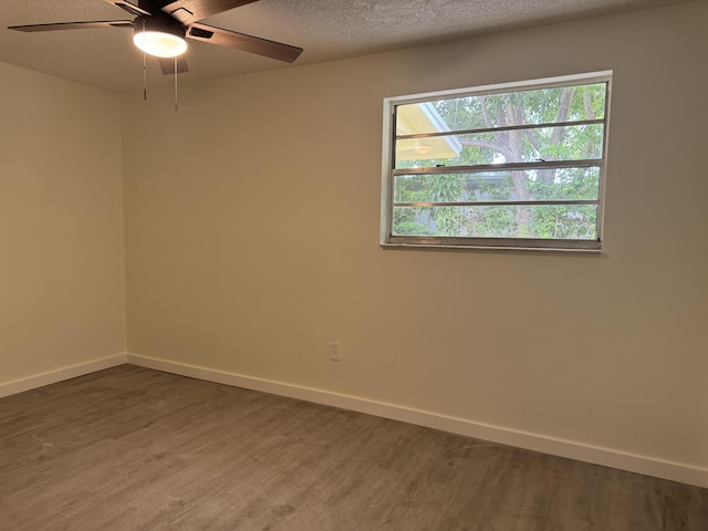 220 W Indies Rd, Tavernier, FL 33070 - unfurnished room with wood finished floors, ceiling fan, and a textured ceiling