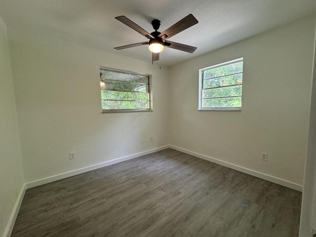 220 W Indies Rd, Tavernier, FL 33070 - spare room featuring plenty of natural light, dark wood-type flooring, and ceiling fan
