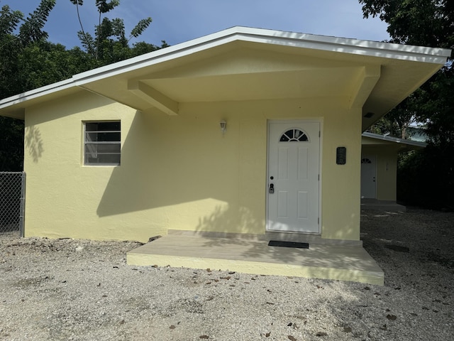 220 W Indies Rd, Tavernier, FL 33070 - doorway to property with stucco siding