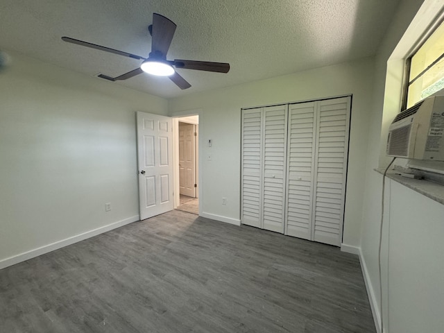 220 W Indies Rd, Tavernier, FL 33070 - unfurnished bedroom with dark wood finished floors, a closet, a ceiling fan, and a textured ceiling