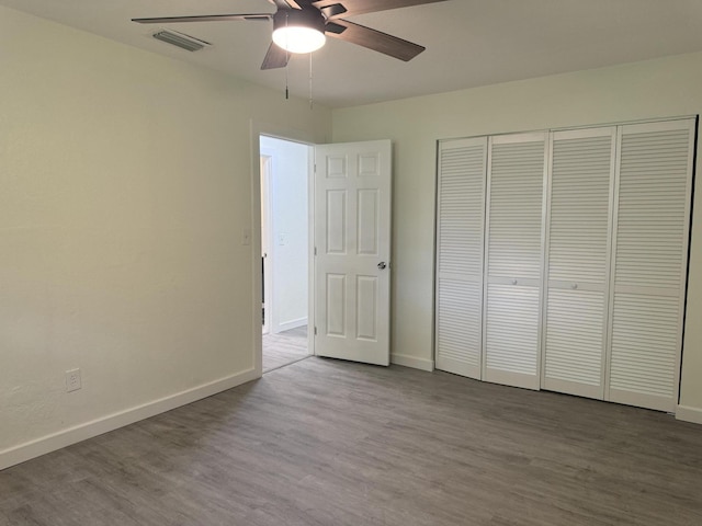 220 W Indies Rd, Tavernier, FL 33070 - unfurnished bedroom with wood finished floors, a closet, and a ceiling fan