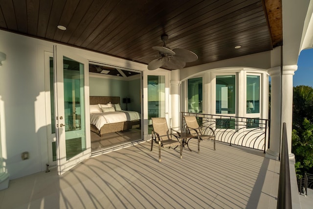 wooden terrace featuring ceiling fan