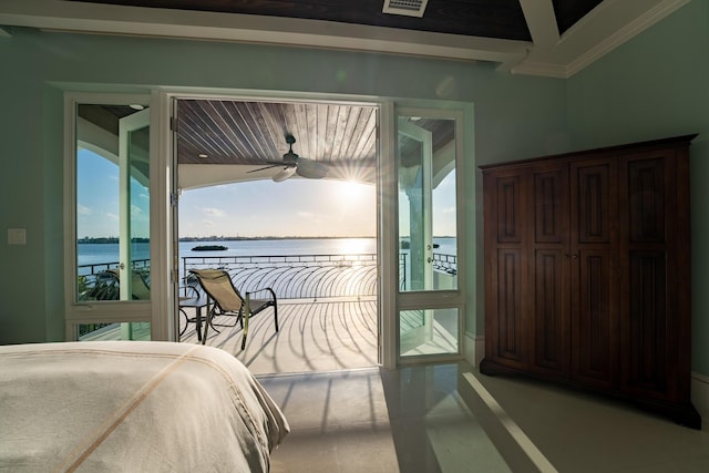 bedroom with a water view and access to outside