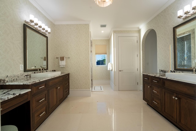 bathroom featuring ornamental molding and vanity