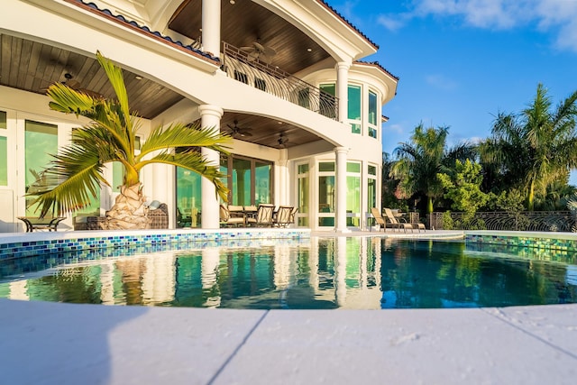 view of pool with ceiling fan and a patio area