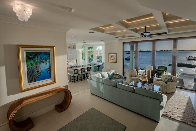 living room featuring beamed ceiling, crown molding, a water view, and coffered ceiling