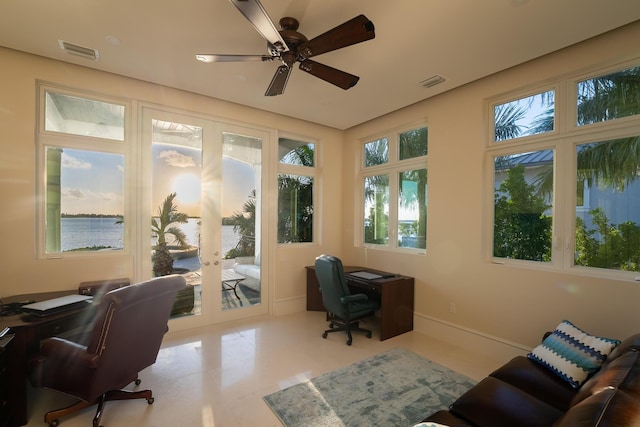 office area with a water view, ceiling fan, and french doors