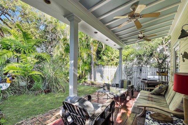 view of patio with a grill and ceiling fan