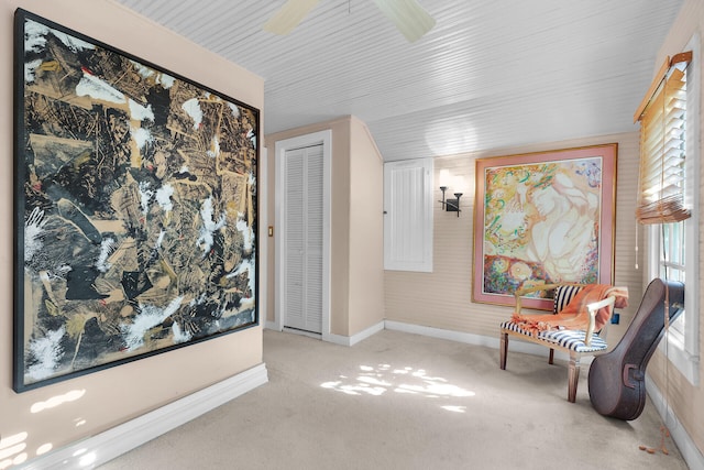 sitting room featuring light colored carpet