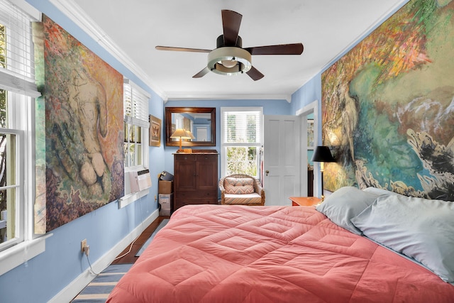 bedroom with ceiling fan and ornamental molding