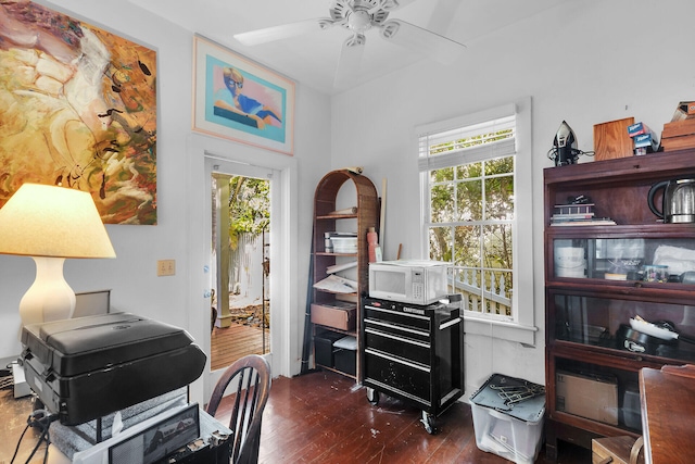 office with dark wood-type flooring and ceiling fan