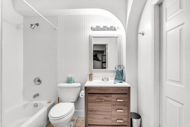 full bathroom featuring tiled shower / bath, vanity, toilet, and tile patterned flooring