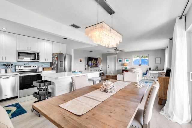 dining area featuring ceiling fan