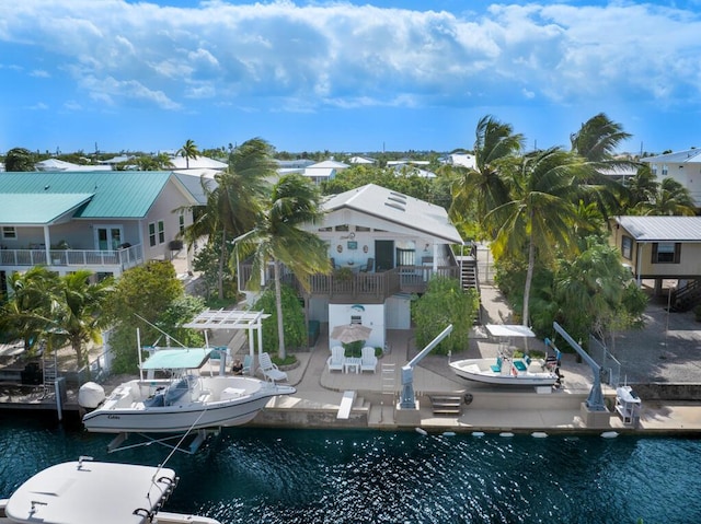 view of dock featuring a patio, a water view, and a pergola