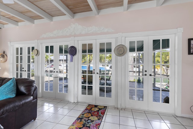 doorway featuring french doors, wood ceiling, beam ceiling, and light tile patterned floors