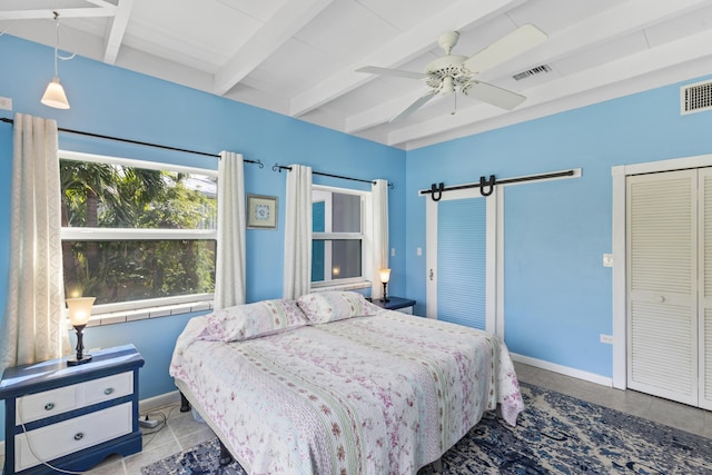 bedroom featuring ceiling fan, light tile patterned floors, and beamed ceiling