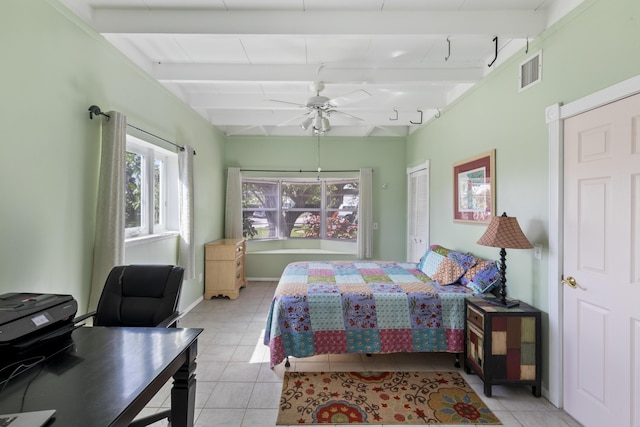 tiled bedroom featuring ceiling fan and beamed ceiling