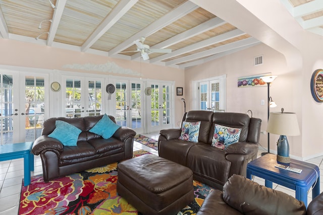 living room featuring french doors, tile patterned floors, and beam ceiling