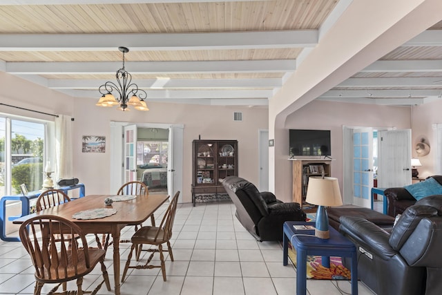 tiled dining area featuring french doors, beam ceiling, and a chandelier