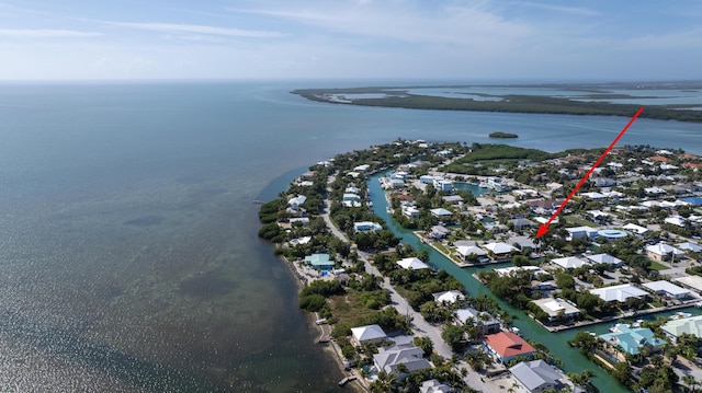 birds eye view of property with a residential view and a water view