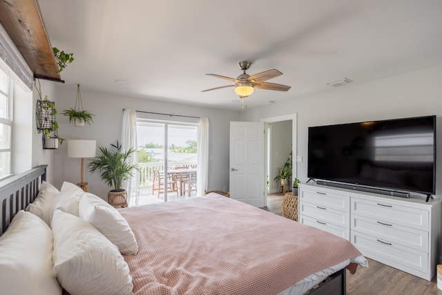 bedroom with access to exterior, hardwood / wood-style floors, and ceiling fan