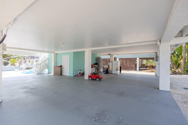 garage with white fridge