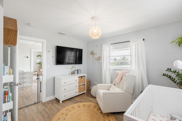 bedroom with light hardwood / wood-style flooring