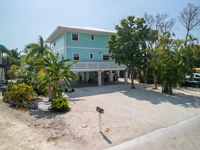 view of front of property with a carport