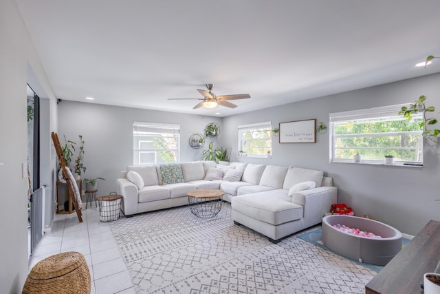 tiled living room featuring ceiling fan