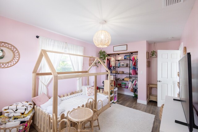 bedroom featuring dark wood-type flooring