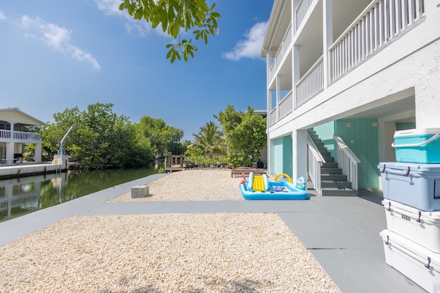 exterior space with a patio and a water view