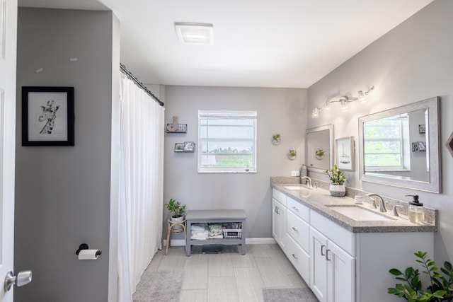 bathroom with a healthy amount of sunlight and vanity