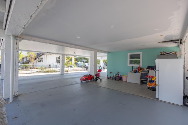 garage with white refrigerator