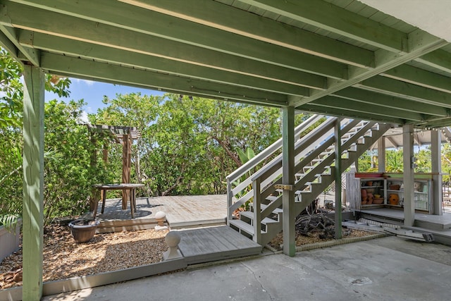 view of patio featuring stairway and a deck