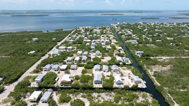 drone / aerial view with a water view and a residential view