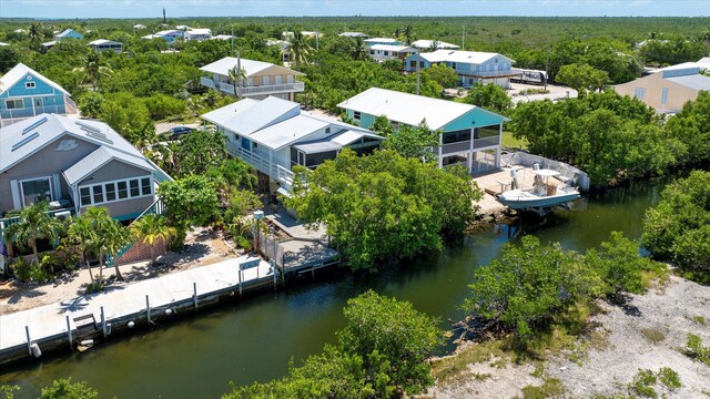 bird's eye view featuring a residential view and a water view