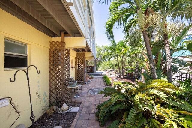 exterior space featuring a patio area and stucco siding