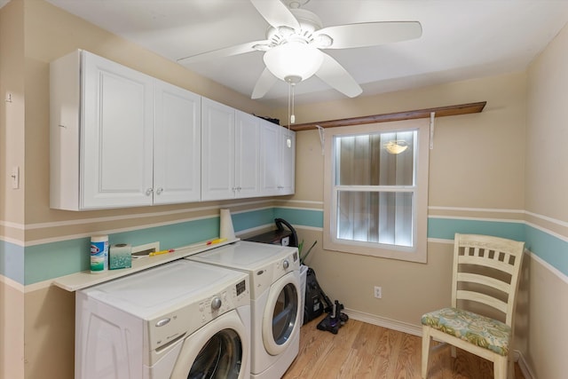 clothes washing area with cabinet space, baseboards, a ceiling fan, light wood-type flooring, and separate washer and dryer