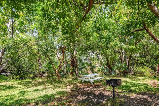 exterior space featuring a wooded view