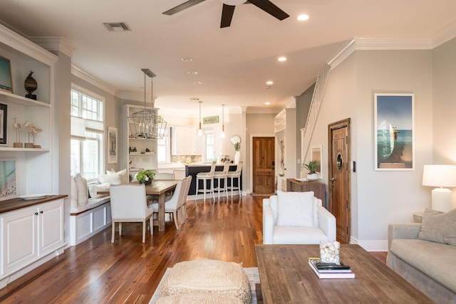 106 Admirals Ln, Key West, FL 33040 - living room featuring dark wood-type flooring, ceiling fan, ornamental molding, plenty of natural light, and recessed lighting