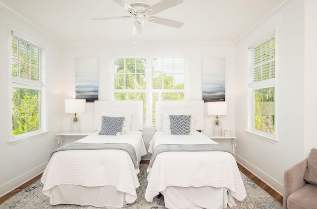 106 Admirals Ln, Key West, FL 33040 - bedroom with baseboards, wood finished floors, multiple windows, crown molding, and a ceiling fan