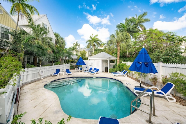106 Admirals Ln, Key West, FL 33040 - community pool featuring a patio area, fence, and an outdoor structure