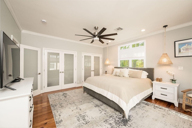 106 Admirals Ln, Key West, FL 33040 - bedroom featuring french doors, dark wood-style flooring, crown molding, ceiling fan, and recessed lighting