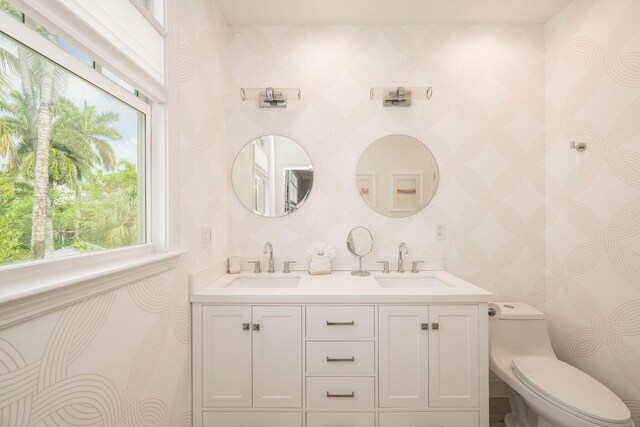 106 Admirals Ln, Key West, FL 33040 - full bathroom featuring wallpapered walls, toilet, and double vanity