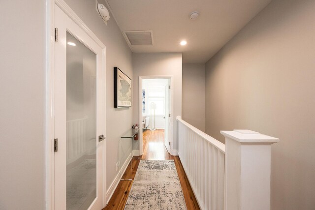 106 Admirals Ln, Key West, FL 33040 - hallway with wood finished floors, an upstairs landing, and recessed lighting