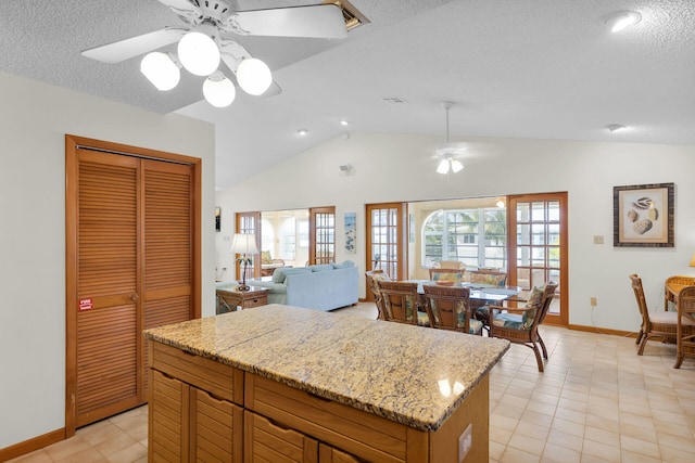 444 Calle De Luna, Marathon, FL 33050 - kitchen featuring vaulted ceiling, a textured ceiling, ceiling fan, baseboards, and visible vents