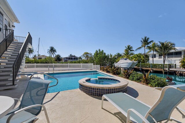 444 Calle De Luna, Marathon, FL 33050 - view of pool featuring a pool with connected hot tub, a patio, stairway, and fence