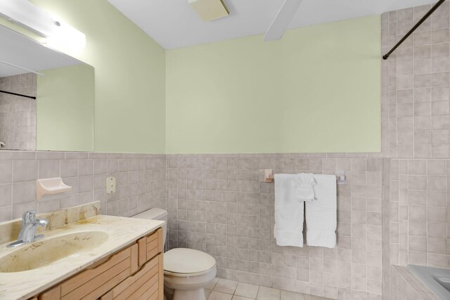 444 Calle De Luna, Marathon, FL 33050 - bathroom with tile walls, toilet, vanity, and tiled shower
