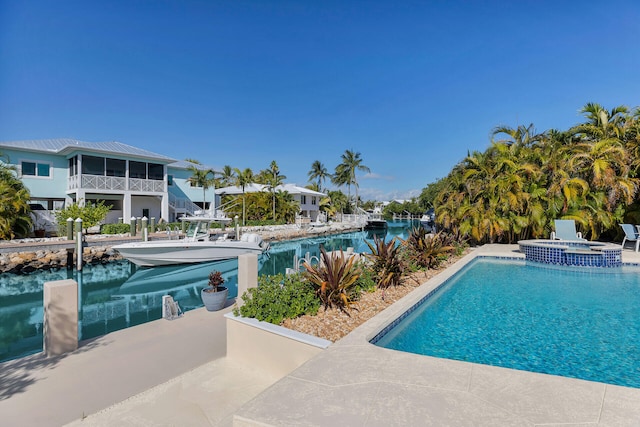 444 Calle De Luna, Marathon, FL 33050 - view of pool featuring a dock, a pool with connected hot tub, and a water view