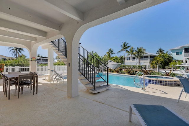 444 Calle De Luna, Marathon, FL 33050 - view of pool with a patio area, a pool with connected hot tub, stairs, and fence